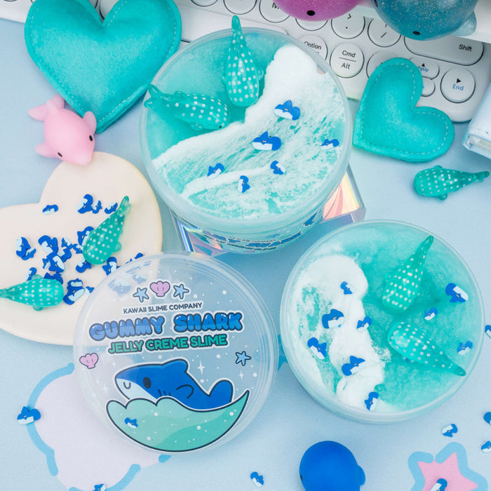 Jelly crème slime with shark design on a light blue background