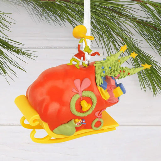 Dr. Seuss's How the Grinch Stole Christmas!™ Grinch on Sleigh Hallmark Ornament, and small tree hanging on a branch 
