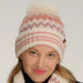 Cheveux Corp chevron pom beanie winter hat featuring a patterned design and decorative pom accent for seasonal styling.