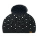 Black Cheveux Corp beanie with a raised diamond crochet pattern, pearl accents, ribbed cuff, large fluffy ivory pom, and small brown logo patch.
