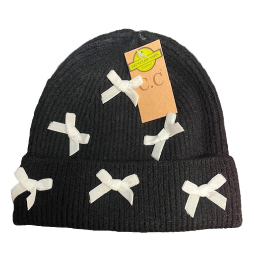 Black Hat with white bows on a laptop