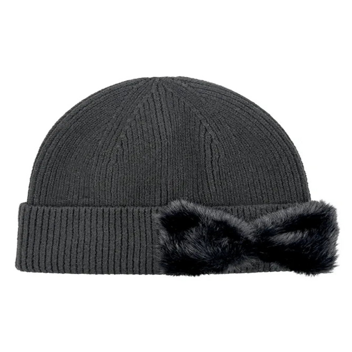 Cheveux Corp blush pink ribbed knit beanie with a rounded crown, wide folded cuff, and large matching faux fur bow on the right side of the cuff, shown against a white background.