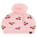 Pink Cheveux Corp beanie with red rhinestone cherries, green stems, and a fluffy ivory pom-pom.