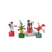 Set of colorful wooden toy figures on a light surface with a blurred background