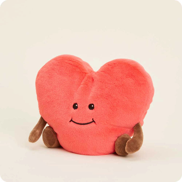 Smiling Warmies Heart Plush soft microwavable heating plush shown at an angle