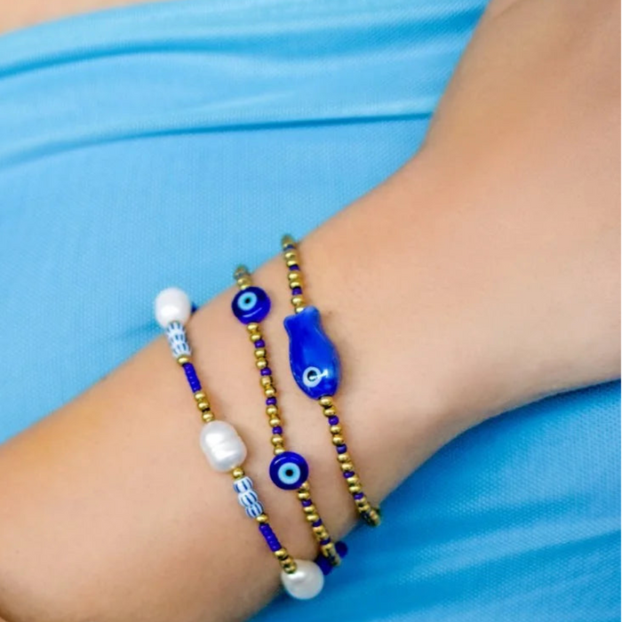 Stia ISLA Cobalt Evil Eye Bracelet featuring a cobalt blue evil eye charm on a delicate bracelet, designed as a stylish accessory believed to symbolize protection and good fortune.
