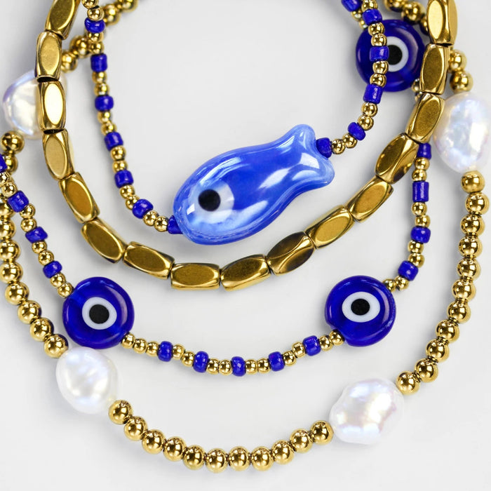 Stia ISLA Cobalt Evil Eye Bracelet featuring a cobalt blue evil eye charm on a delicate bracelet, designed as a stylish accessory believed to symbolize protection and good fortune.