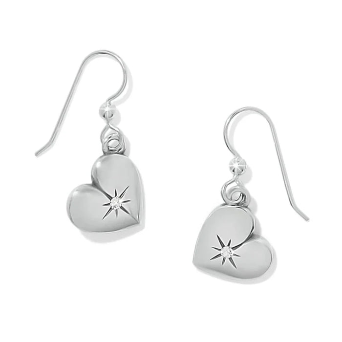  A pair of elegant silver earrings shaped like hearts, showcasing a polished finish and delicate design.
