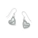 Silver heart-shaped earrings with a shiny surface, perfect for adding a touch of romance to any outfit.