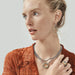 Elegant silver and gold teardrop earrings, perfect for enhancing your outfit with a splash of color.
