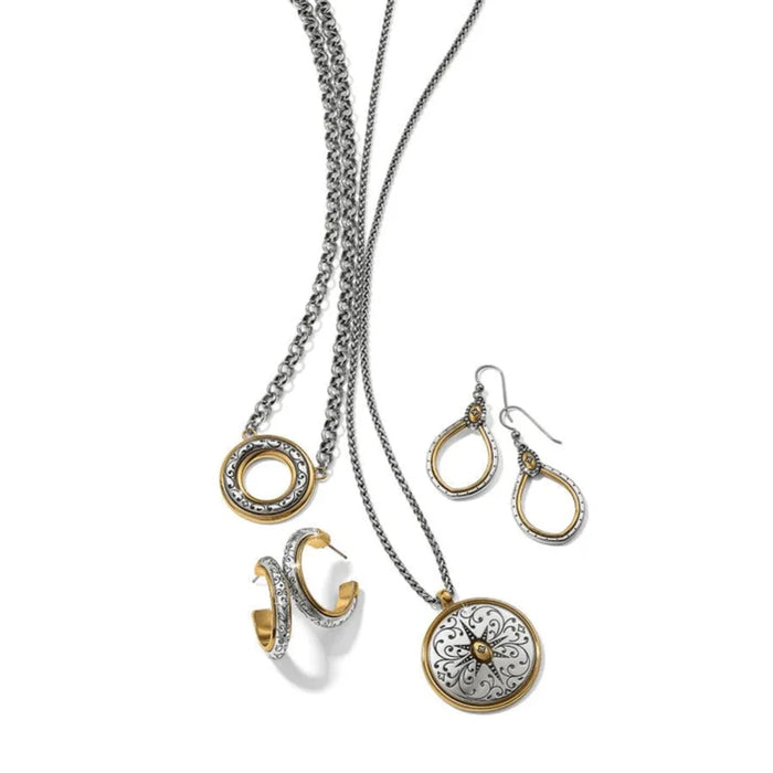 Chic silver and gold teardrop earrings, a perfect accessory to brighten up your outfit.