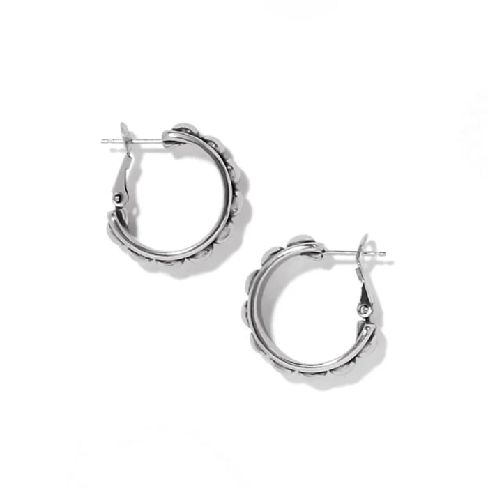 A stylish pair of silver hoop earrings with decorative beads, ideal for enhancing any jewelry collection.