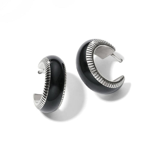 Pair of black and silver hoop earrings on a white background
