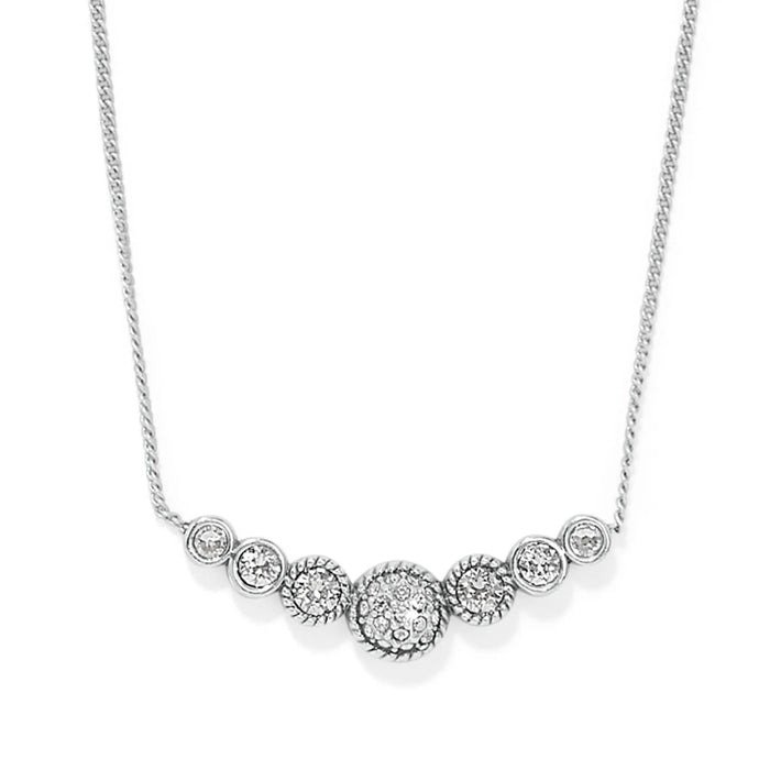 This elegant piece features a slightly curved bar with a petite circular dome at the heart of three stones on either side. A truly precious little treasure, that suspends from a fine delicate chain.
