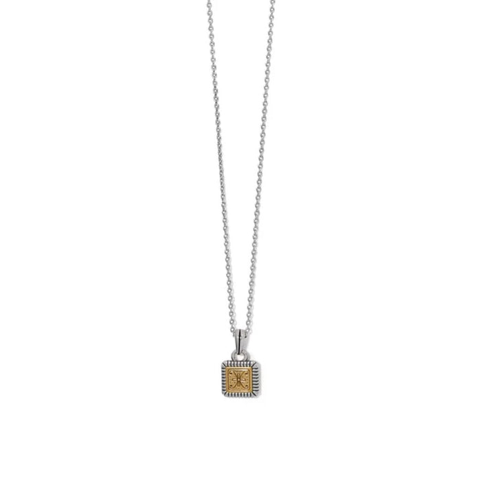 A small square pendant hanging from a gold and silver chain, showcasing a blend of elegant metals.