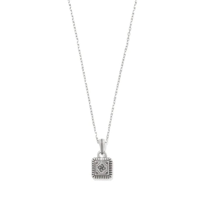 A small square pendant attached to a gold and silver chain, featuring a modern and chic design.