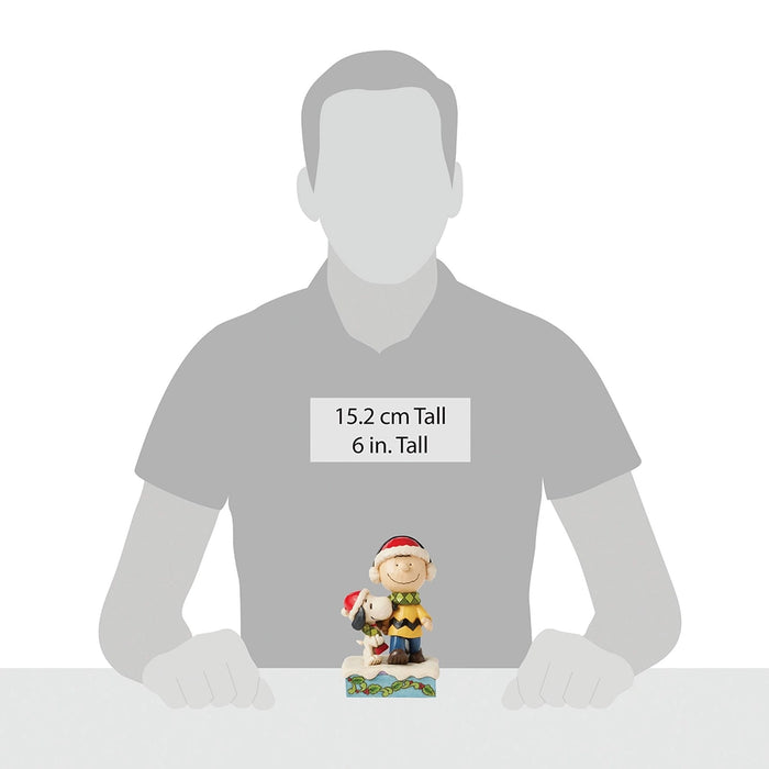 Size reference showing 6-inch Charlie & Snoopy holiday figurine on display.