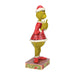 Side view of Grinch figurine showing hand-carved details and textured patterns.