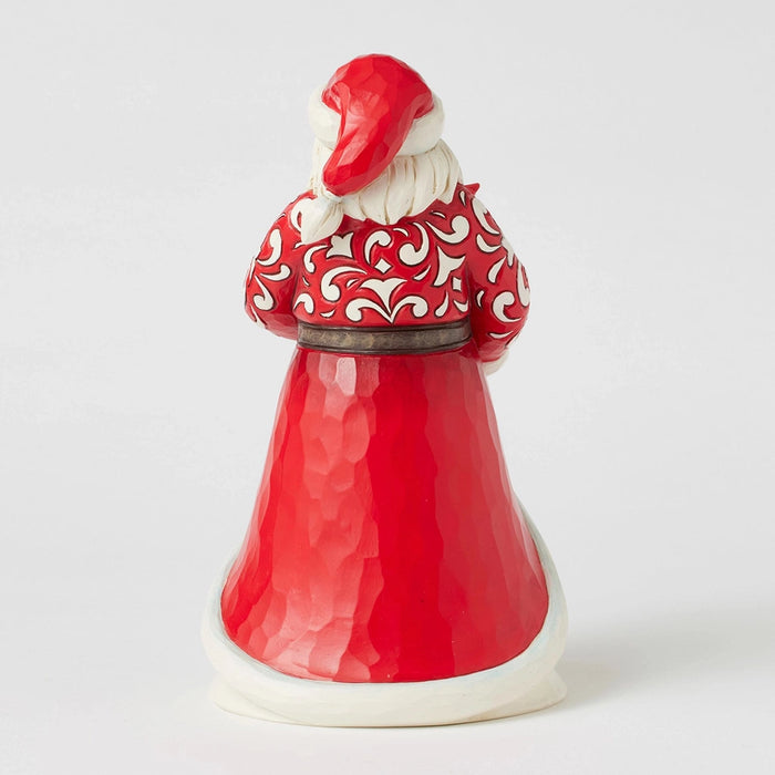 Back view of Santa’s robe with intricate red and white scrollwork.