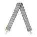 Patterned bag strap with gold hardware on a white background