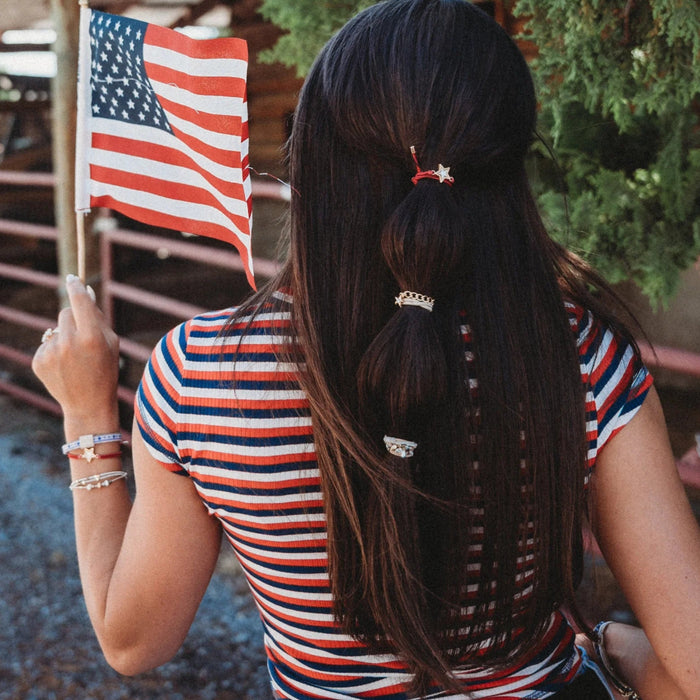 Liberty patriotic red, white, and blue hair tie bracelet with gold and silver star accents.
