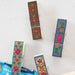 A collection of three cheerful clips, each with unique colors and patterns, designed to bring joy and positivity.