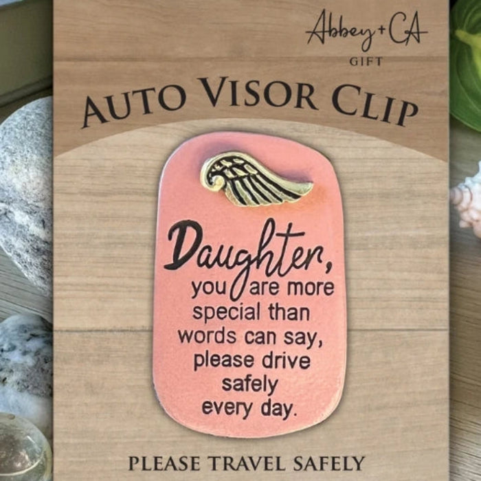 Cathedral Art Daughter Auto Visor Clip featuring an inspirational sentiment and elegant design that securely attaches to a vehicle sun visor as a meaningful keepsake.