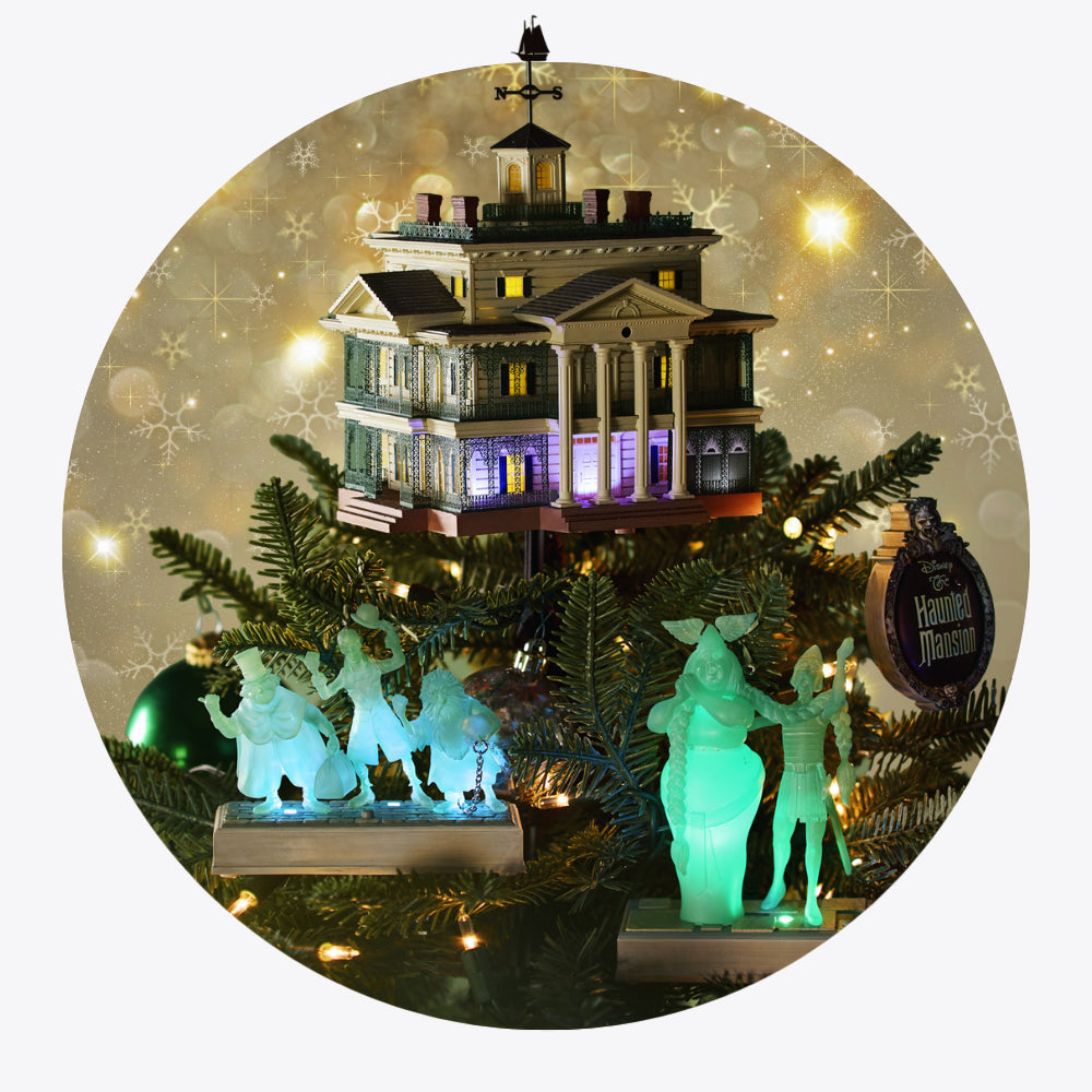 Haunted Mantion Keepsake Ornaments - Decorative Christmas scene with a haunted house ornament, green figures, and festive background
