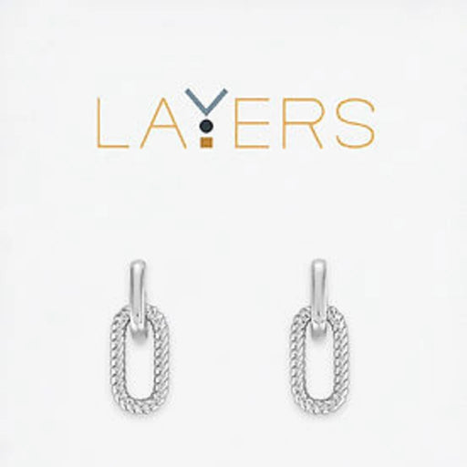 A pair of silver earrings featuring a delicate chain and a loop design, elegantly hanging from the earlobe.