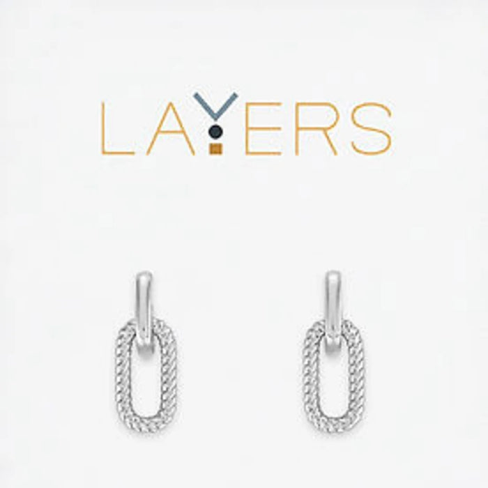 A pair of silver earrings featuring a delicate chain and a loop design, elegantly hanging from the earlobe.