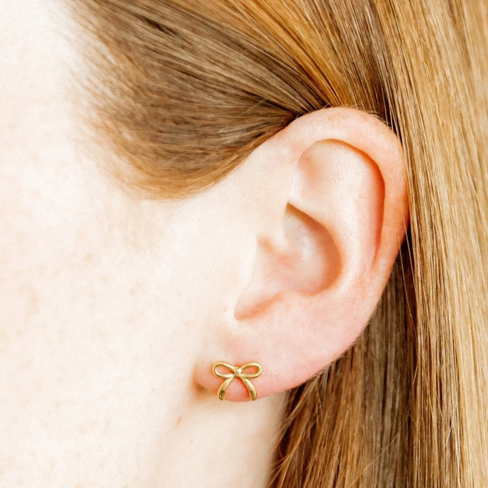 This elegance and charm with their 12mm thin gold bow design, perfect for any occasion.