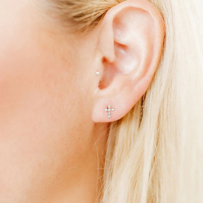  These 7mm studs provide a subtle yet meaningful accent to any look. Crafted from 100% surgical-grade stainless steel, these earrings are lightweight, durable, and hypoallergenic, making them perfect for sensitive ears. 