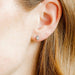 The Paloma Pear Silver Screwback Stud Earrings offer a refined and elegant design with a modern twist.