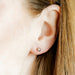 the Evelyn Screwback Stud Earrings in silver feature a 4mm smooth, polished sphere for a clean, minimalist look.