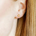 Playful and shining, the Lennon Screwback Stud Earrings feature a petite cut-out star design crafted in polished gold-toned stainless steel.