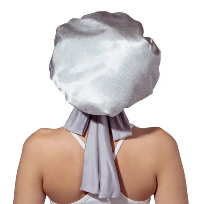 The DM Merchandising Lemon Lavender Snooze Control Satin Sleep Bonnet protects your hair while you sleep