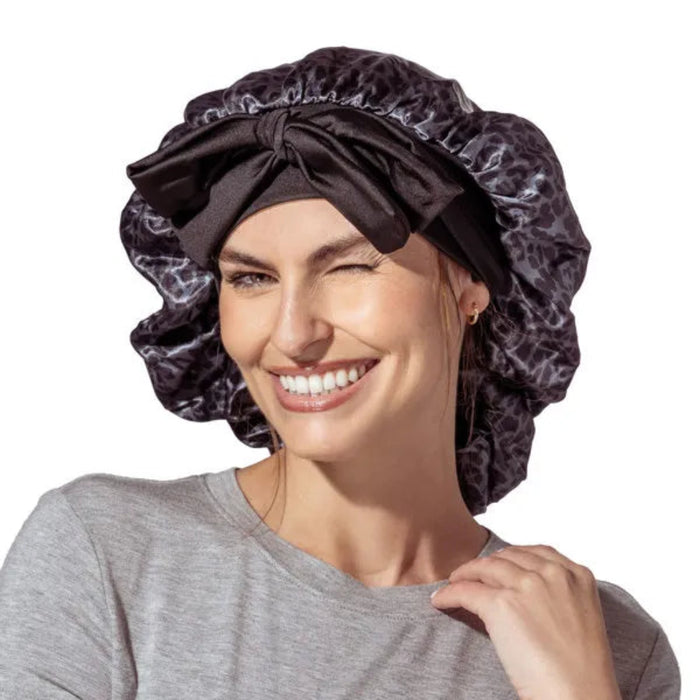 The DM Merchandising Lemon Lavender Snooze Control Satin Sleep Bonnet protects your hair while you sleep