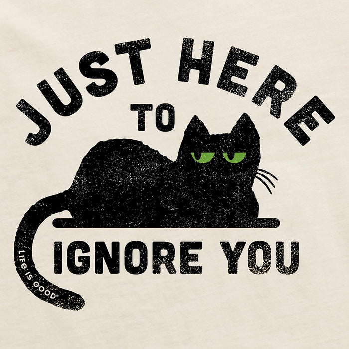 Close-up of Life Is Good Here to Ignore You graphic featuring black cat with green eyes and humorous slogan.