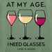 Close-up of Life Is Good I Need Glasses graphic with three colorful wine glasses and humorous saying.