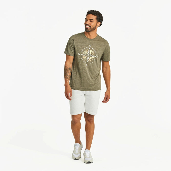 Full outfit view of Life is Good Men's Tribal Compass Crusher Tee – olive green tribal compass t-shirt with shorts