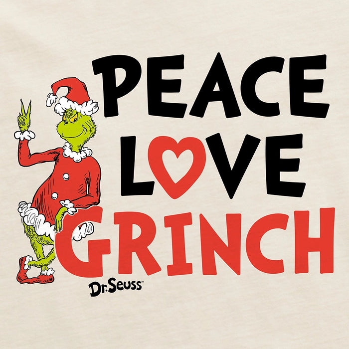 Close-up of “Peace Love Grinch” text and Dr. Seuss Grinch artwork on cream cotton fabric.