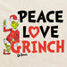Close-up of “Peace Love Grinch” text and Dr. Seuss Grinch artwork on cream cotton fabric.