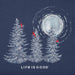 Close-up of Life Is Good Snowy Pines with Cardinals graphic showing snow-covered trees and red cardinals under moonlight.
