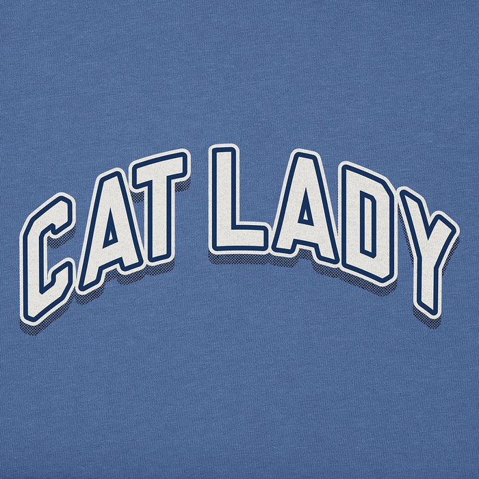 Close-up view of Life Is Good Women's Cat Lady Tee graphic showing bold white and navy outlined CAT LADY text on blue cotton fabric