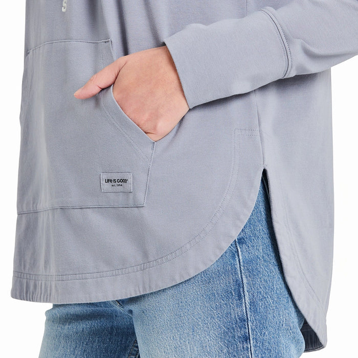 Close-up of the kangaroo pocket on the Life is Good hoodie, highlighting the Life is Good brand tag and stitching details.