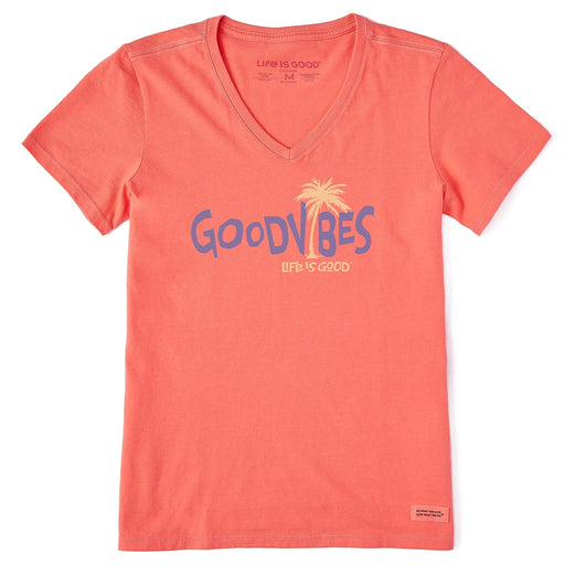 Close-up of Life Is Good Women's Good Vibes Palm Tee graphic featuring bold purple “Good Vibes” text with a yellow palm tree on a coral Crusher Vee T-shirt.
