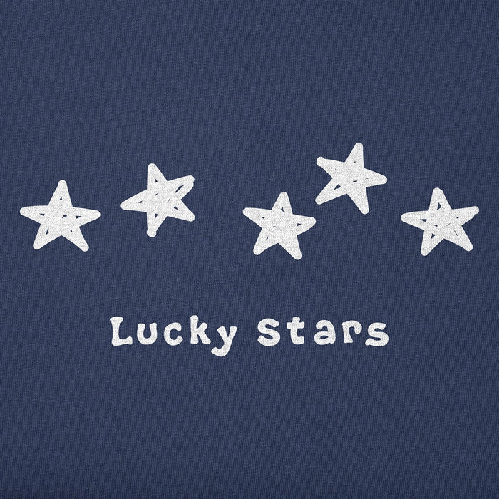 Close-up of distressed red, white, and blue star graphics with the Life Is Good logo on a blue cotton background.