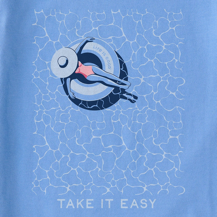 Close-up of Life Is Good Women's Poolside Crusher Tee graphic featuring woman lounging in pool float with Take It Easy text