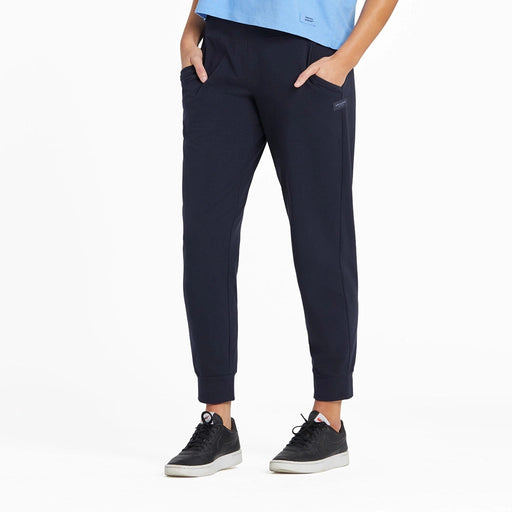 Front view of Life Is Good Women’s Solid Crusher-Flex Jogger in Inkwell Blue with relaxed fit and functional pockets