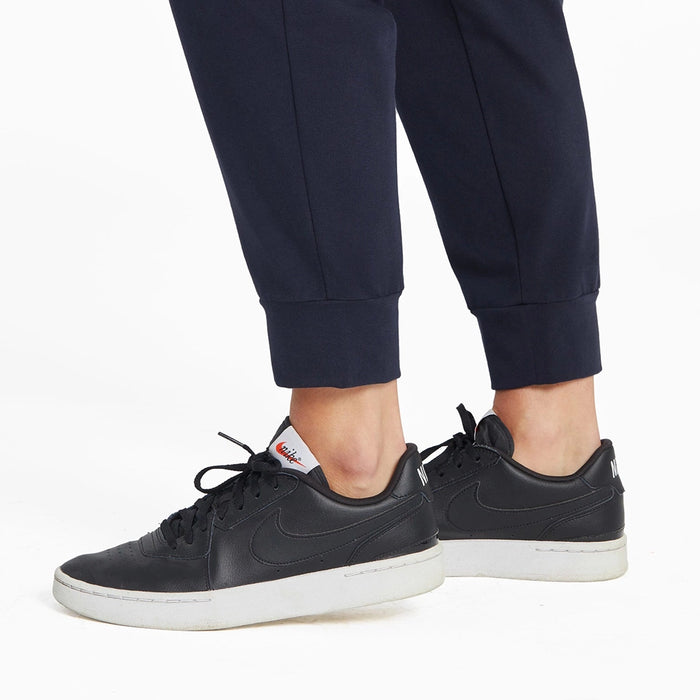 Detail of ribbed ankle cuff on Life Is Good Women’s Crusher-Flex Jogger in Inkwell Blue paired with casual sneakers